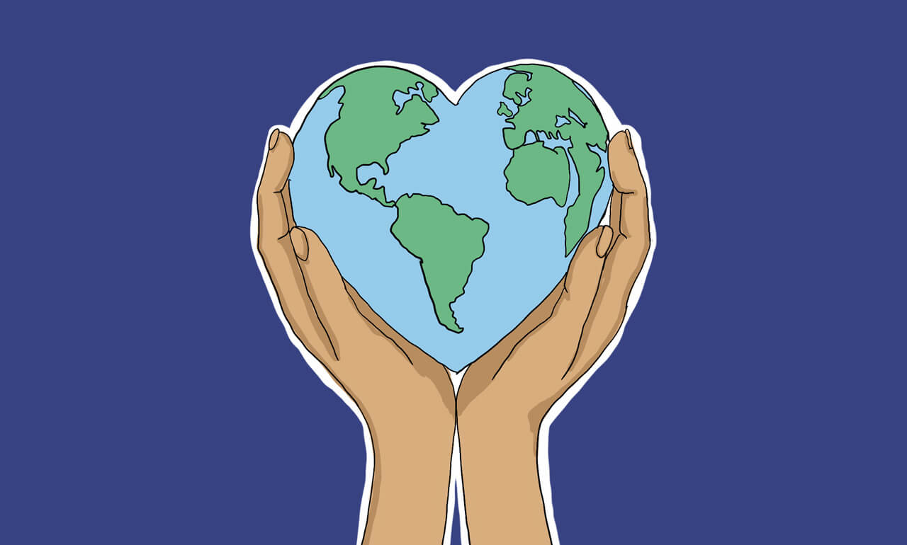 Two hands holding a heart-shaped globe.